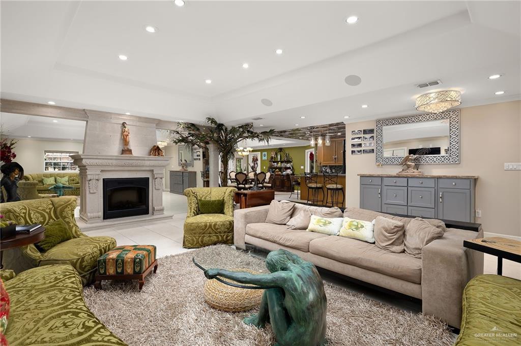301 Vermont Avenue McAllen, TX 78503 - Photo 7 of 25 a living room with furniture and a fireplace
