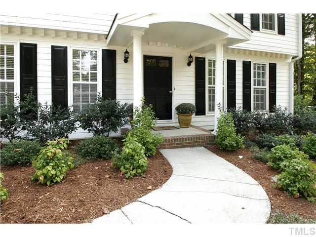 7900 Farmingwood Lane Raleigh, NC 27615 - Photo 23 of 25 a front view of a house with garden