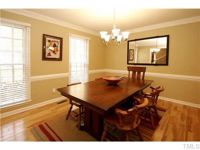7900 Farmingwood Lane Raleigh, NC 27615 - Photo 5 of 25 a view of a dining room with furniture and chandelier