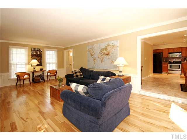7900 Farmingwood Lane Raleigh, NC 27615 - Photo 9 of 25 a living room with furniture and a wooden floor