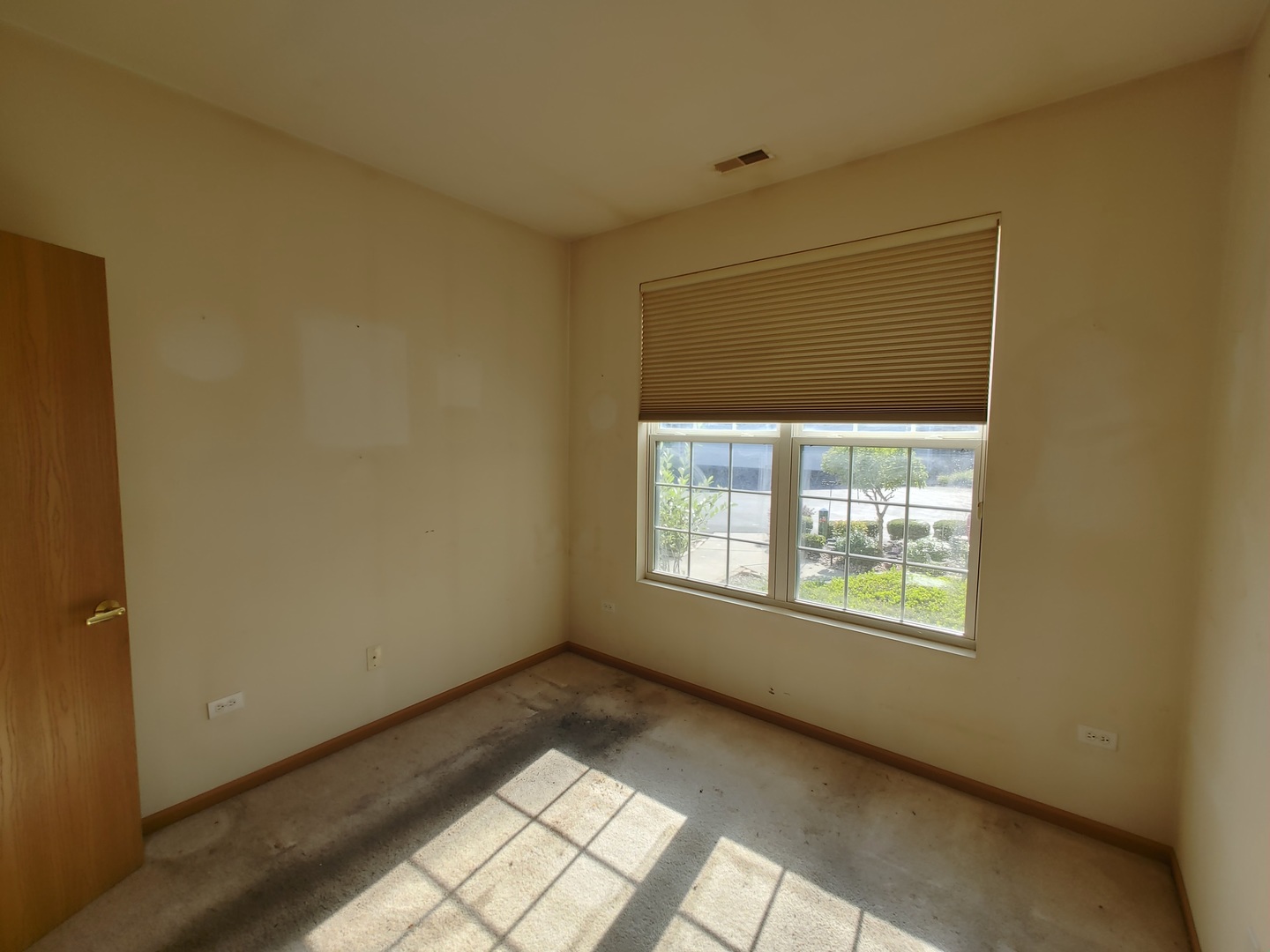 13528 Delaney Road Huntley, IL 60142 - Photo 13 of 25 a view of an empty room with a window