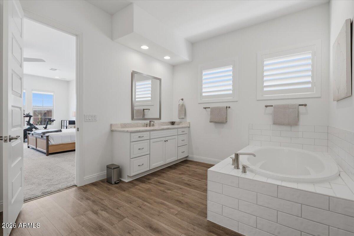 22608 East Stacey Road Queen Creek, AZ 85142 - Photo 37 of 83 a bathroom with a tub sink and mirror