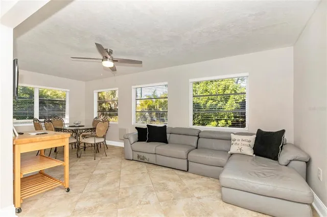 a dining room with furniture and window