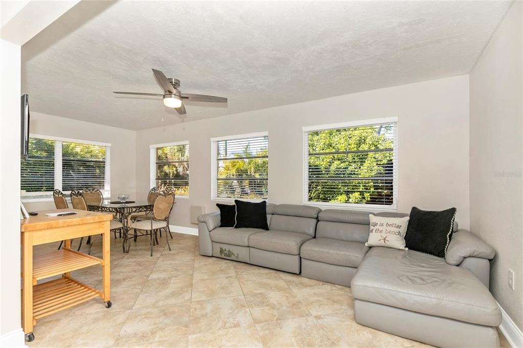 3039 Chase Circle Sarasota, FL 34231 - Photo 15 of 55 a living room with furniture and a large window