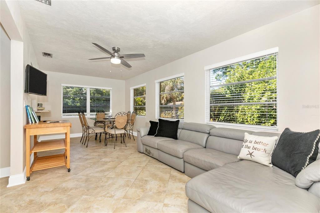 3039 Chase Circle Sarasota, FL 34231 - Photo 16 of 55 a living room with furniture and a large window