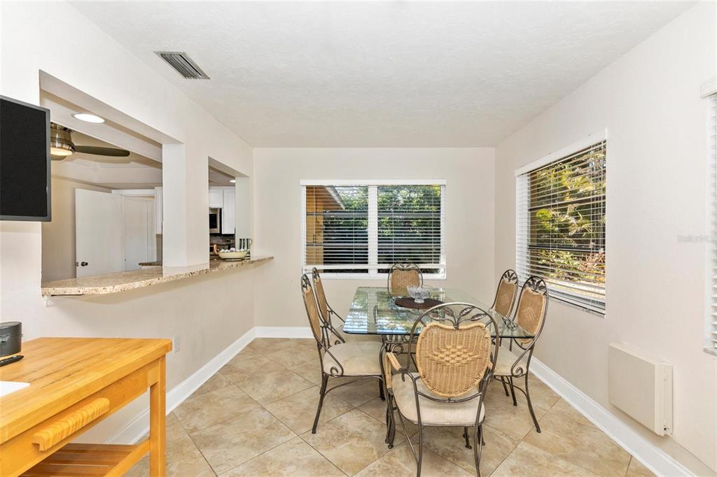 3039 Chase Circle Sarasota, FL 34231 - Photo 17 of 55 a dining room with furniture and window