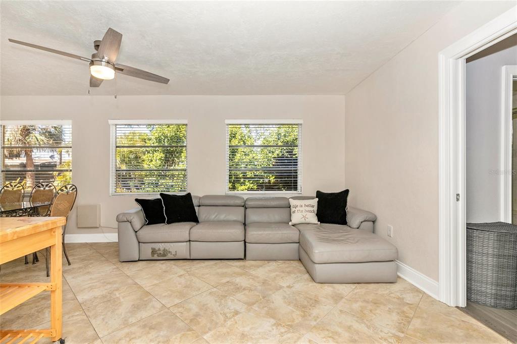 3039 Chase Circle Sarasota, FL 34231 - Photo 19 of 55 a living room with furniture and windows