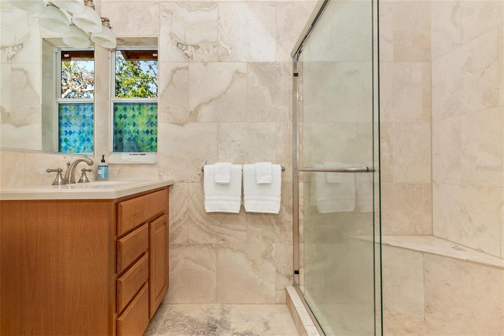 3039 Chase Circle Sarasota, FL 34231 - Photo 32 of 55 a bathroom with a sink and a mirror