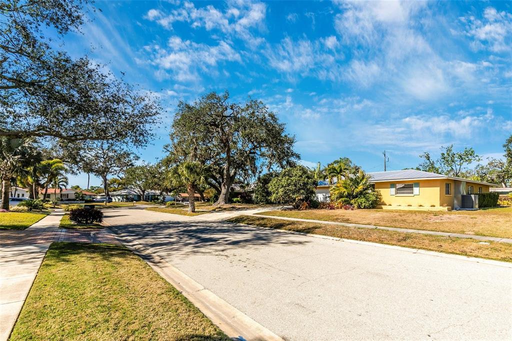 3039 Chase Circle Sarasota, FL 34231 - Photo 46 of 55 a view of a swimming pool with an outdoor space and seating area