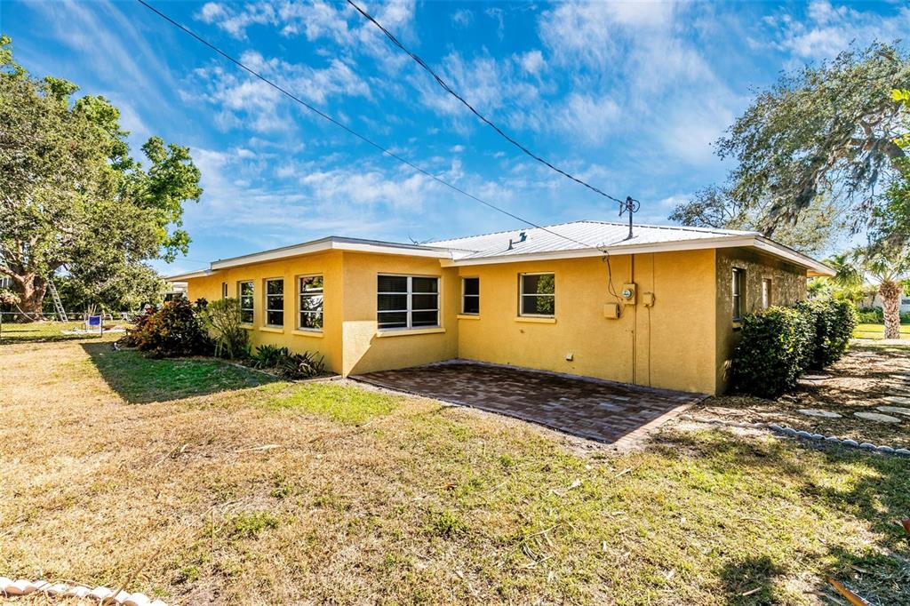 3039 Chase Circle Sarasota, FL 34231 - Photo 49 of 55 a front view of a house with a yard