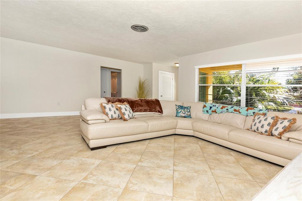 3039 Chase Circle Sarasota, FL 34231 - Photo 10 of 55 a living room with furniture and a large window