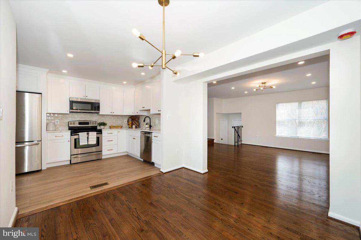 12144 Turnstone Court, Unit 87 Silver Spring, MD 20904 - Photo 15 of 56 a view of kitchen with sink microwave and refrigerator