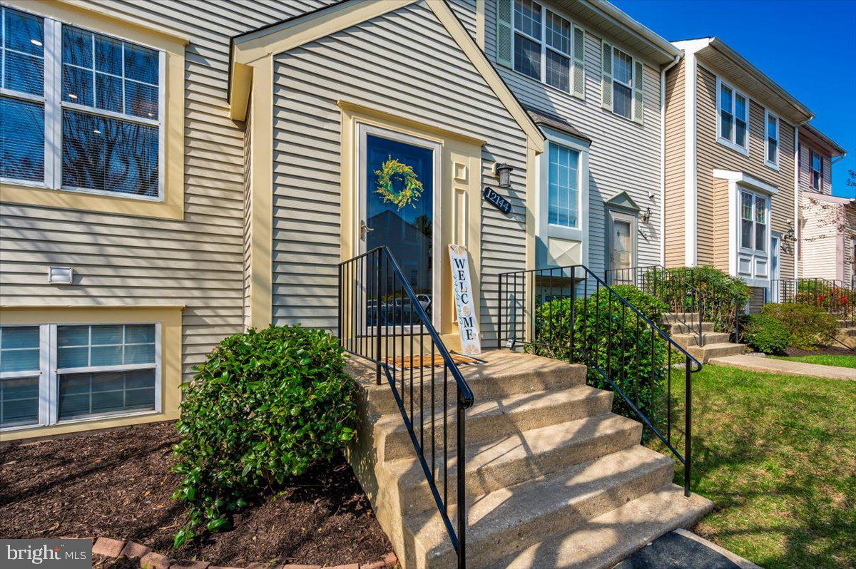 12144 Turnstone Court, Unit 87 Silver Spring, MD 20904 - Photo 2 of 56 a view of a house with backyard and sitting area