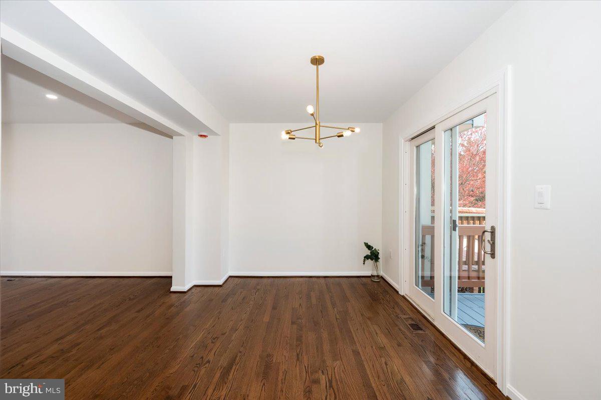 12144 Turnstone Court, Unit 87 Silver Spring, MD 20904 - Photo 22 of 56 wooden floor in an empty room with a window