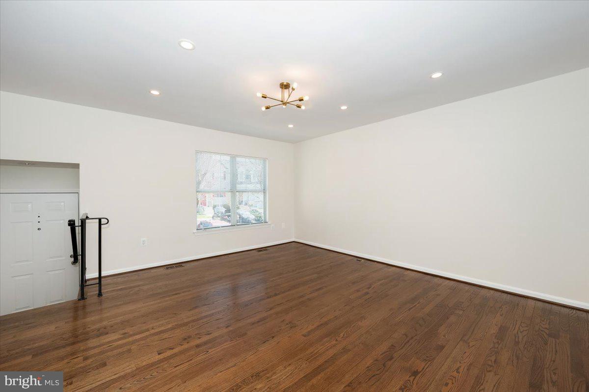 12144 Turnstone Court, Unit 87 Silver Spring, MD 20904 - Photo 24 of 56 wooden floor in an empty room with a window