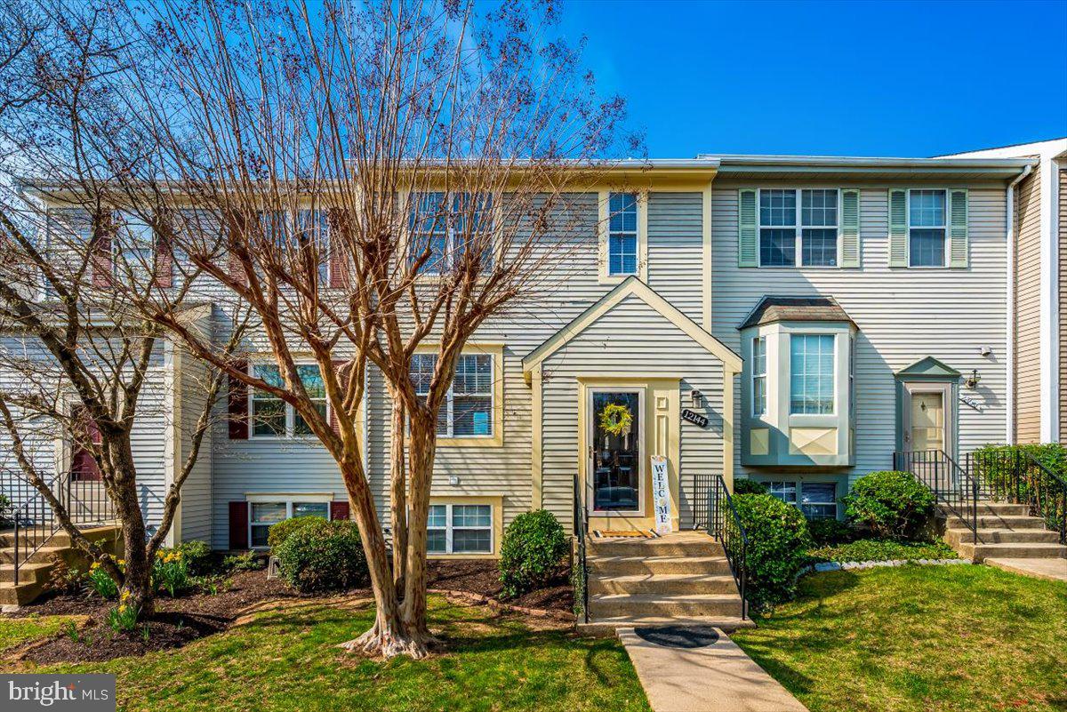 12144 Turnstone Court, Unit 87 Silver Spring, MD 20904 - Photo 3 of 56 a front view of a house with garden