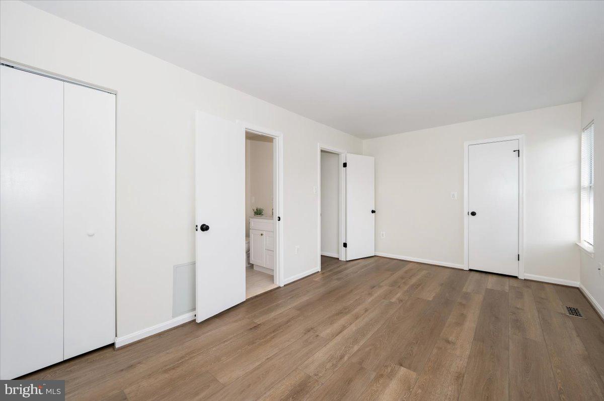 12144 Turnstone Court, Unit 87 Silver Spring, MD 20904 - Photo 33 of 56 a view of an empty room with wooden floor
