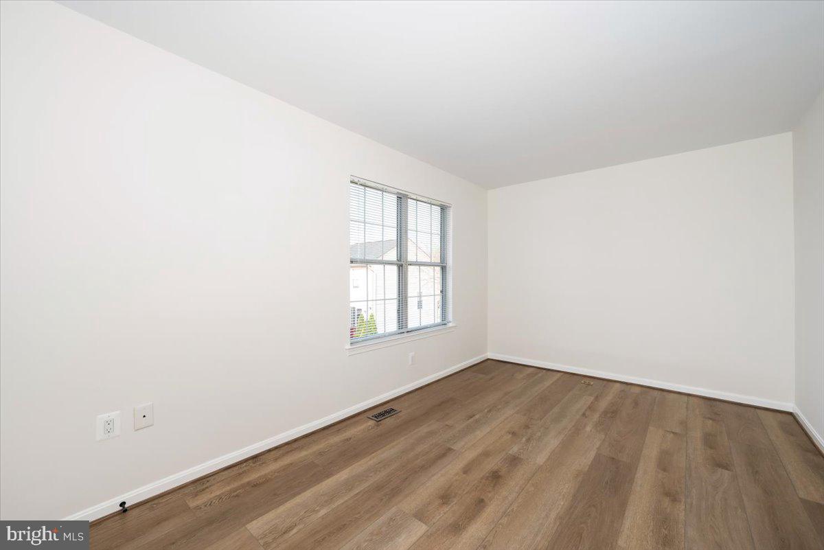 12144 Turnstone Court, Unit 87 Silver Spring, MD 20904 - Photo 38 of 56 an empty room with a window