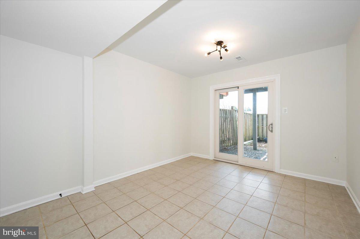 12144 Turnstone Court, Unit 87 Silver Spring, MD 20904 - Photo 43 of 56 a view of an empty room with a window