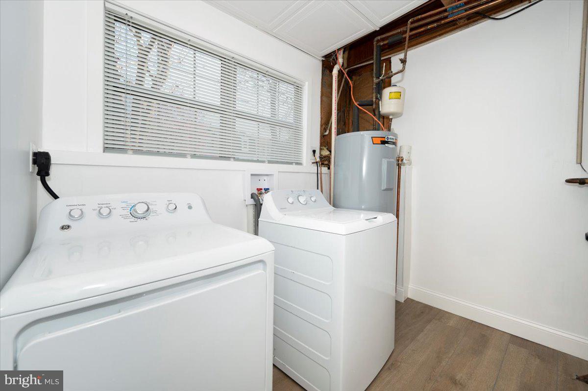 12144 Turnstone Court, Unit 87 Silver Spring, MD 20904 - Photo 45 of 56 a utility room with dryer and washer