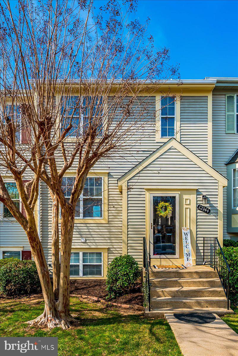 12144 Turnstone Court, Unit 87 Silver Spring, MD 20904 - Photo 5 of 56 a front view of a house with garden