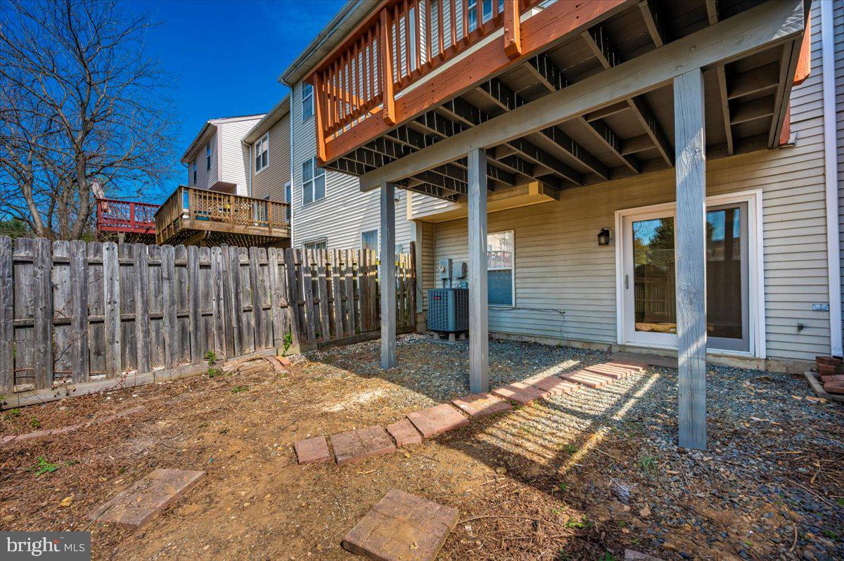 12144 Turnstone Court, Unit 87 Silver Spring, MD 20904 - Photo 54 of 56 a view of a patio with a table and chairs