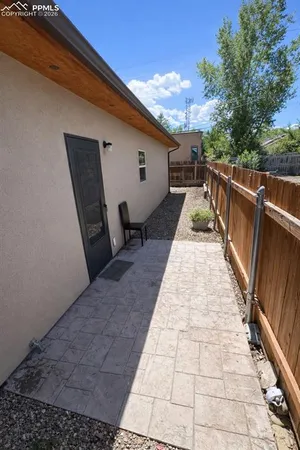 a view of a balcony with wooden floor and fence