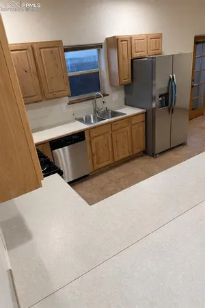 a bedroom with bed and window