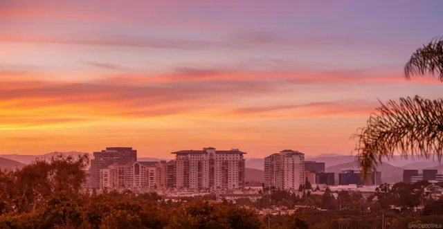 a view of a city with tall buildings in the background