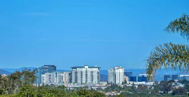 a view of a city with tall buildings in the background