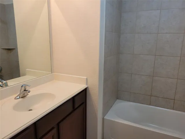 a bathroom with a sink and a bathtub