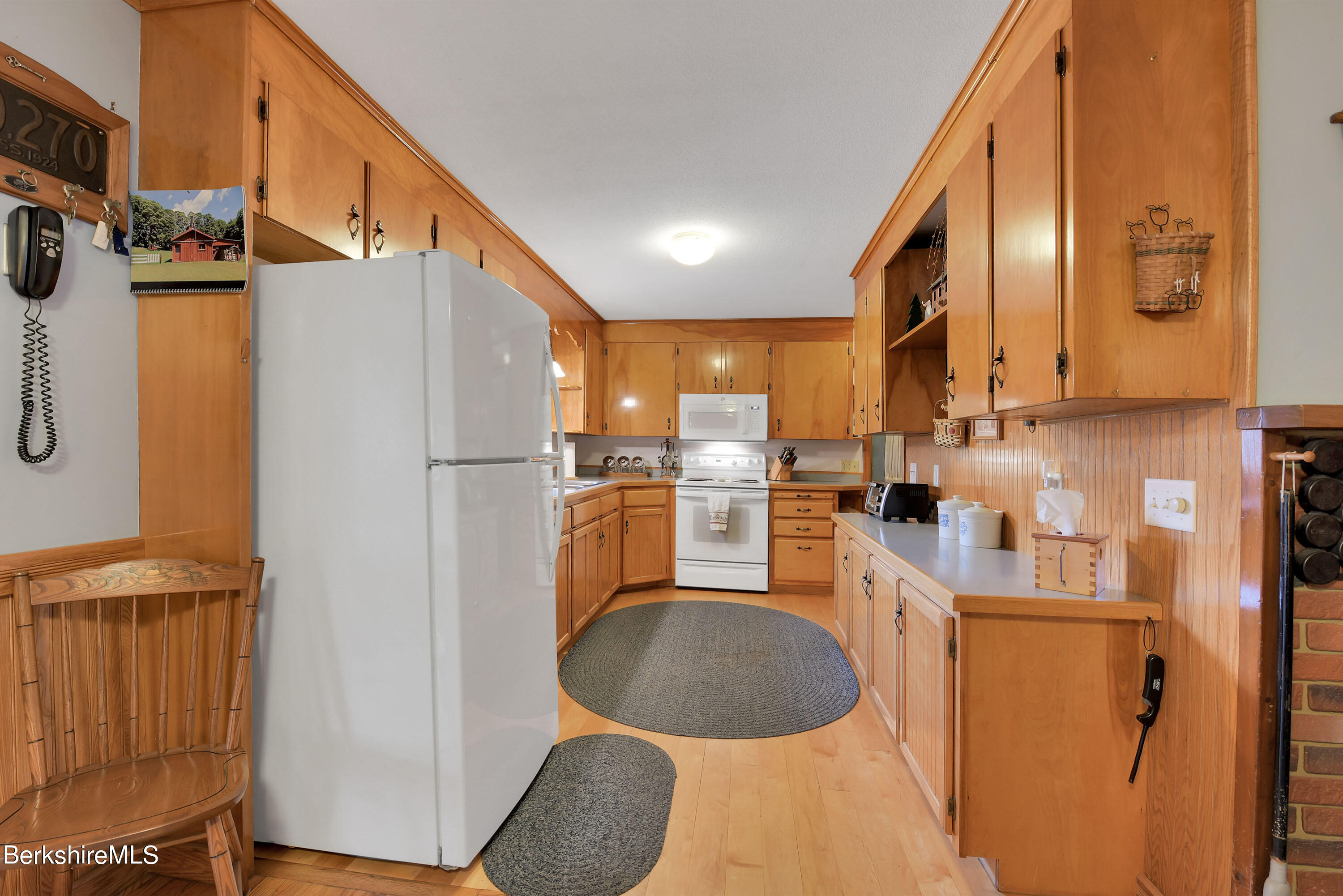 100 Town Hill Road Middlefield, MA 01011 - Photo 11 of 76 a kitchen with stainless steel appliances granite countertop a refrigerator a stove and a sink with wooden floor