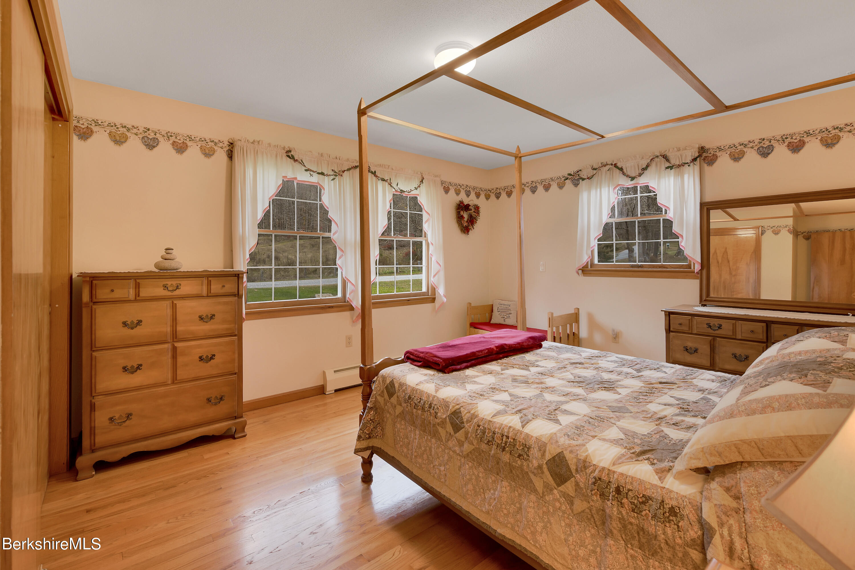 100 Town Hill Road Middlefield, MA 01011 - Photo 15 of 76 a bedroom with a bed and wooden floor