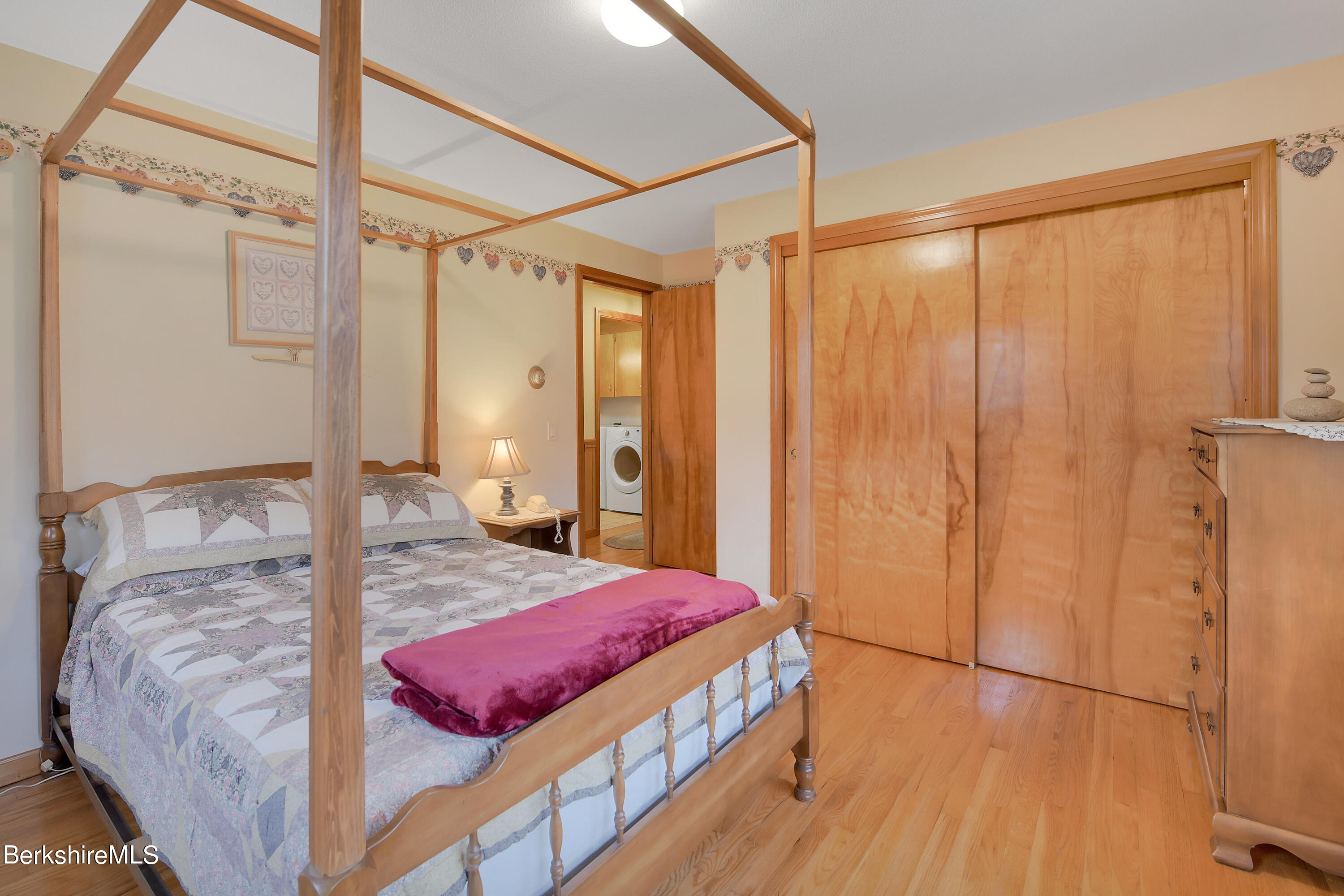 100 Town Hill Road Middlefield, MA 01011 - Photo 16 of 76 a bedroom with a bed and a dresser with wooden floor