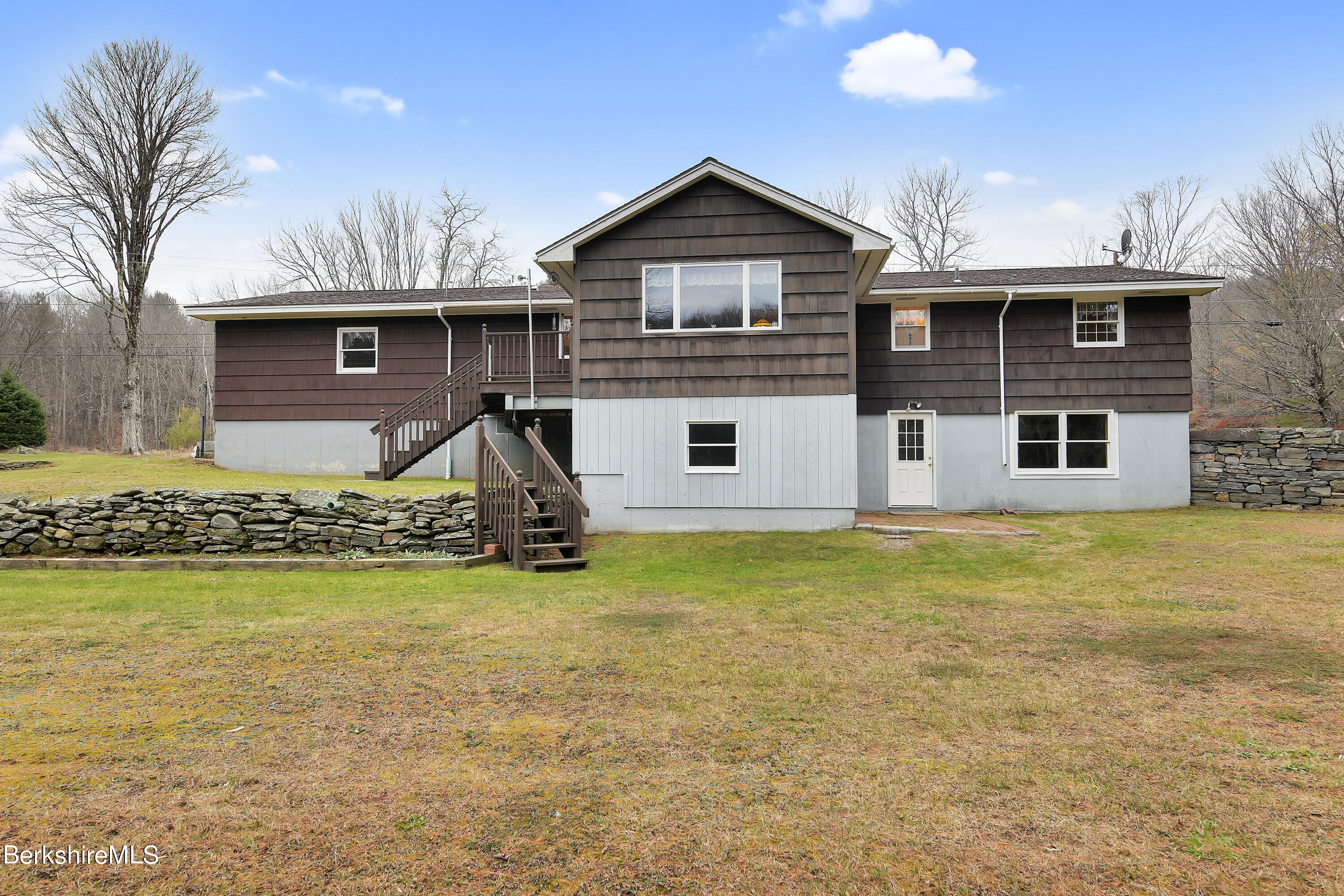 100 Town Hill Road Middlefield, MA 01011 - Photo 37 of 76 a front view of a house with a yard