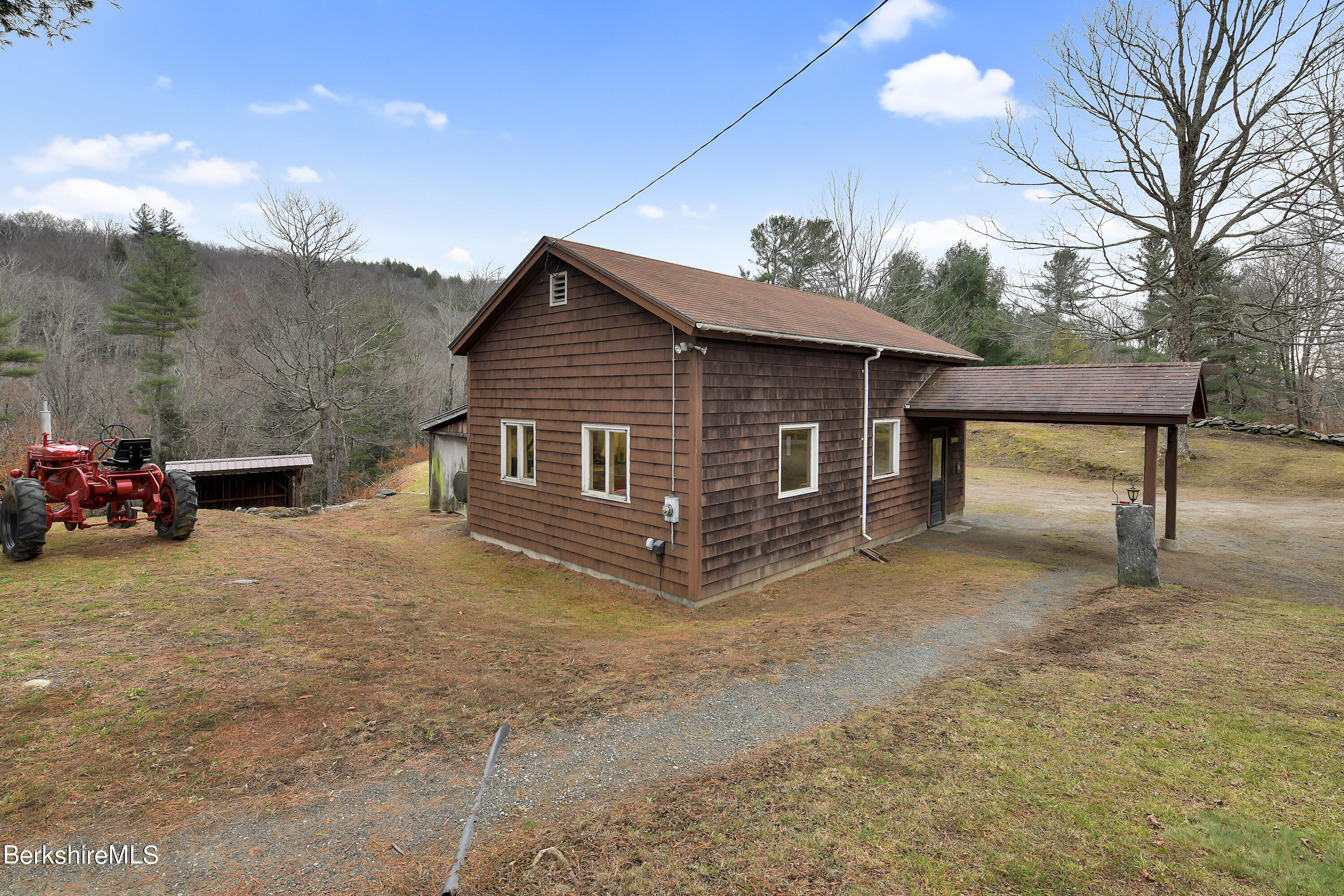 100 Town Hill Road Middlefield, MA 01011 - Photo 40 of 76 a view of a house with a yard