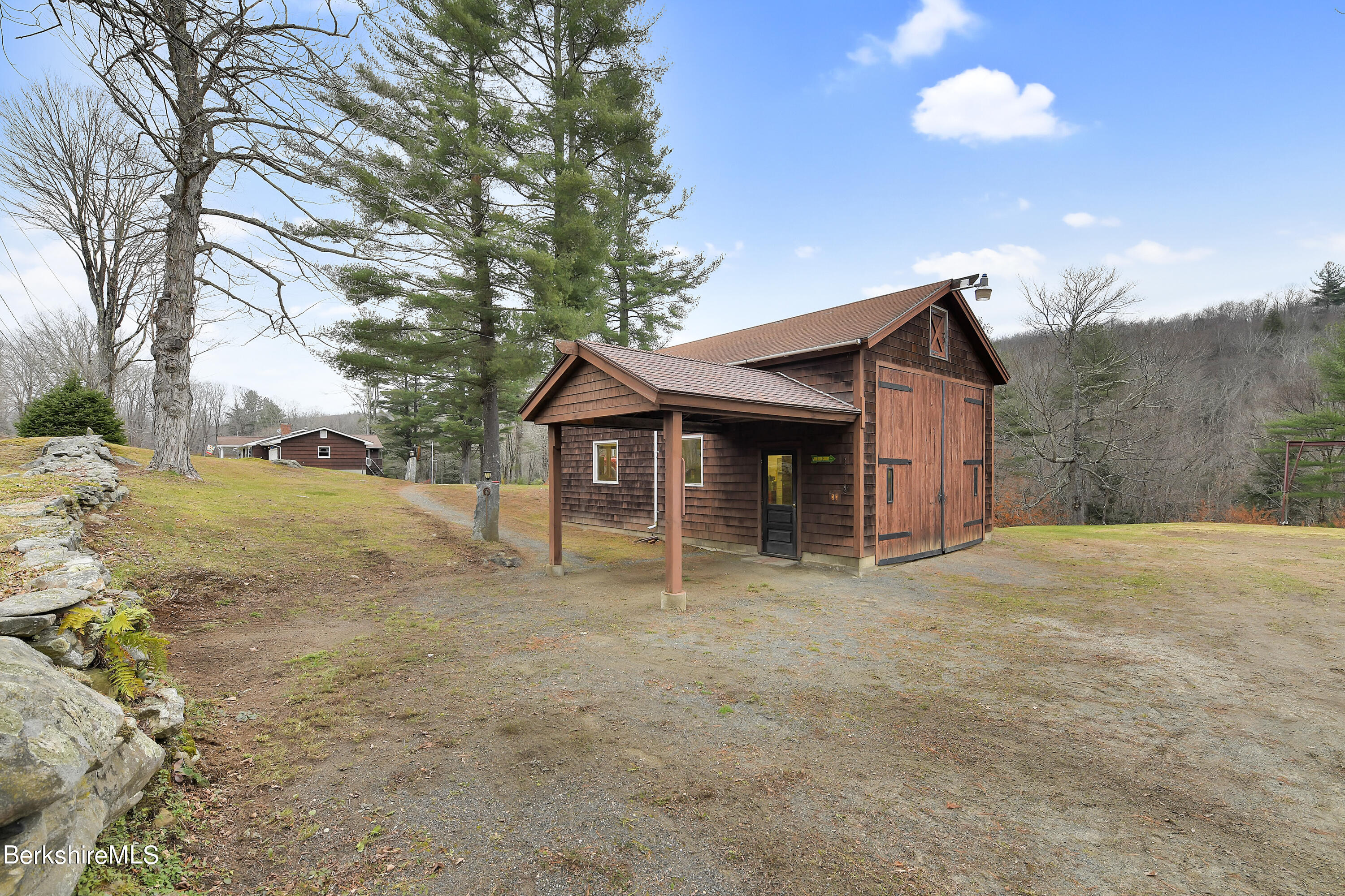 100 Town Hill Road Middlefield, MA 01011 - Photo 41 of 76 a front view of a house with a yard