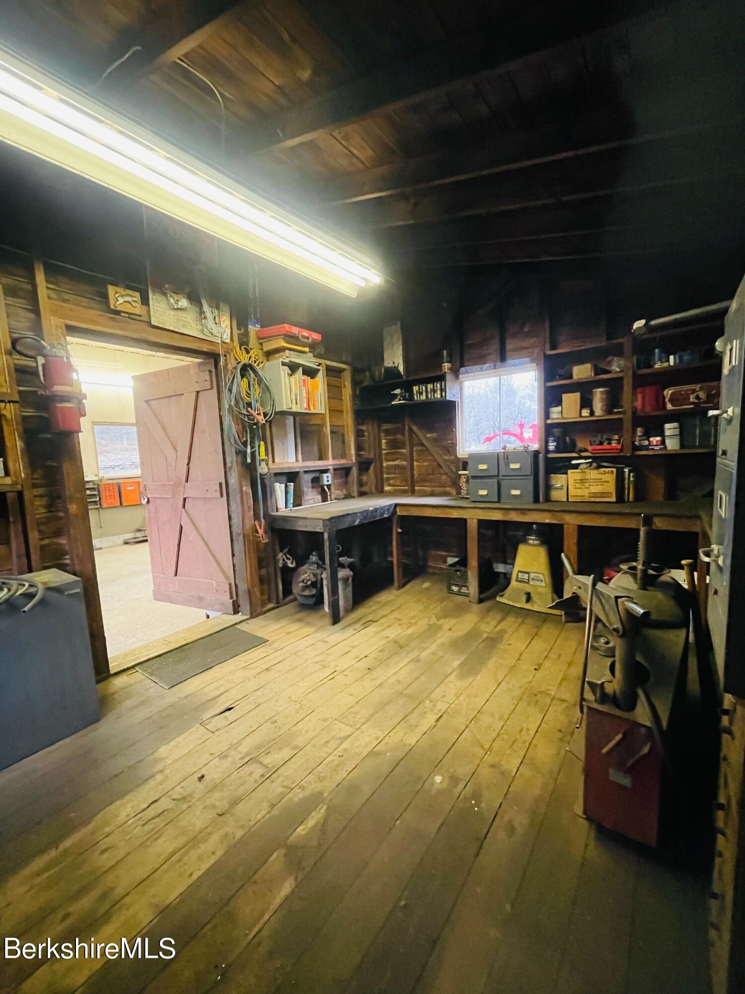 100 Town Hill Road Middlefield, MA 01011 - Photo 48 of 76 a room with lots of wooden furniture and a garage