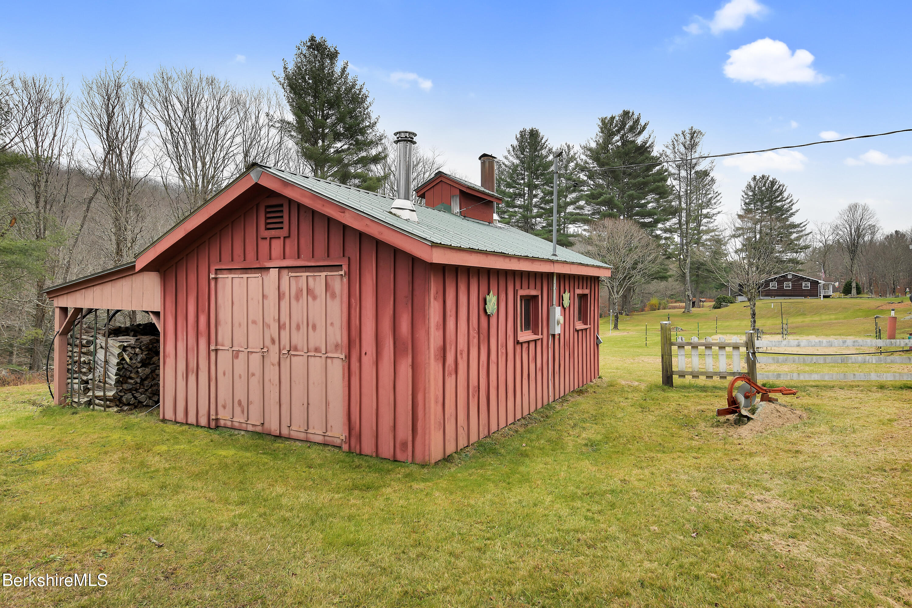 100 Town Hill Road Middlefield, MA 01011 - Photo 50 of 76 a view of a backyard with a barn