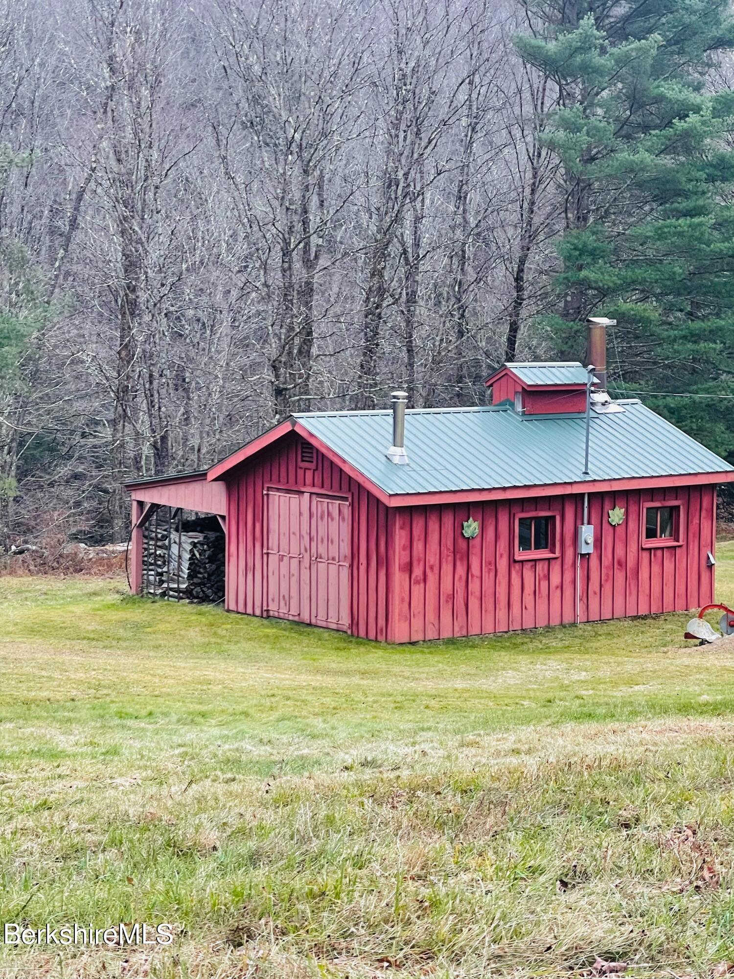 100 Town Hill Road Middlefield, MA 01011 - Photo 51 of 76 a view of a house with a yard