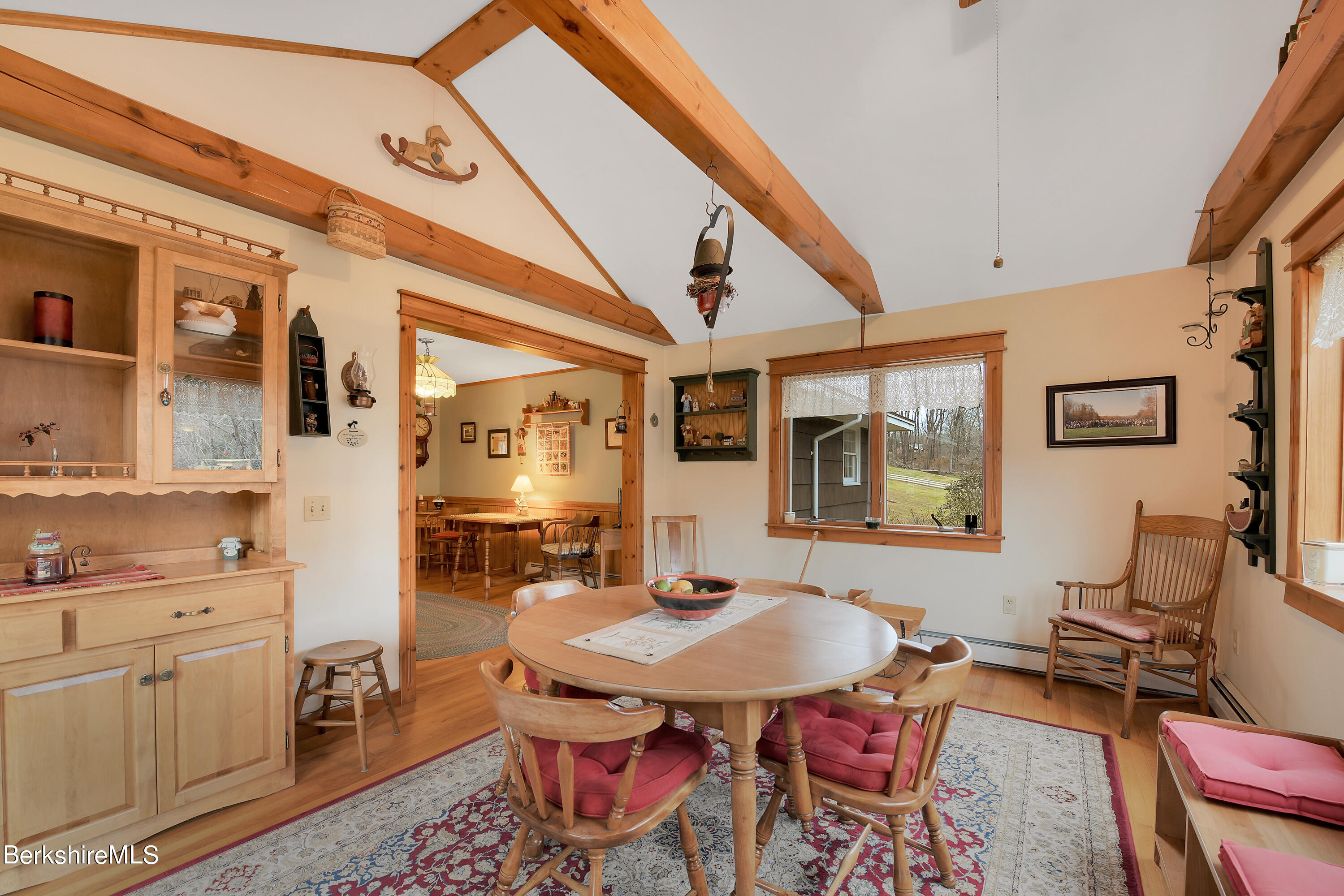 100 Town Hill Road Middlefield, MA 01011 - Photo 8 of 76 a view of a dining room with furniture and wooden floor