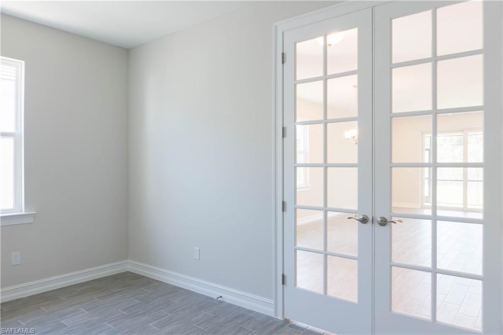 1050 Enbrook Loop Naples, FL 34114 - Photo 13 of 29 an empty room with a window