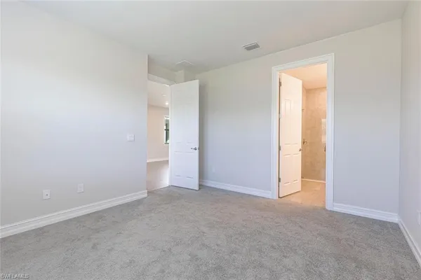 a view of an empty room and a window