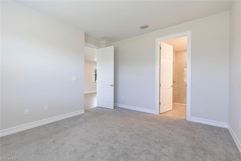 1050 Enbrook Loop Naples, FL 34114 - Photo 14 of 29 a view of an empty room and a window
