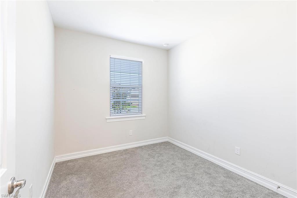 1050 Enbrook Loop Naples, FL 34114 - Photo 15 of 29 an empty room with a window