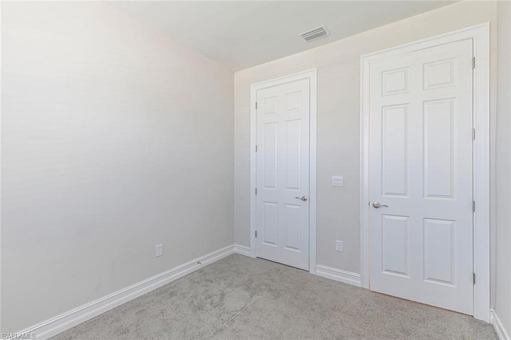 1050 Enbrook Loop Naples, FL 34114 - Photo 16 of 29 a view of an empty room