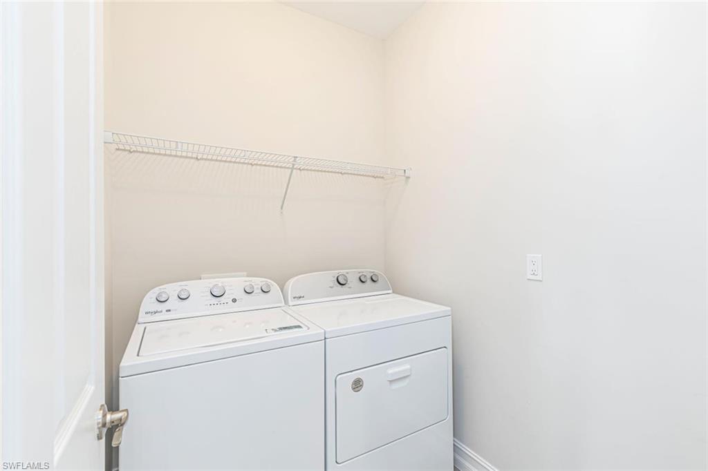 1050 Enbrook Loop Naples, FL 34114 - Photo 18 of 29 a utility room with dryer and washer