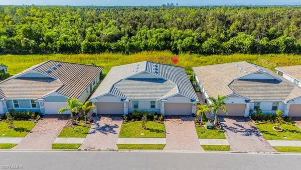 an aerial view of a house with a swimming pool