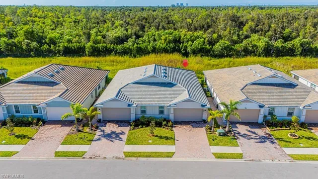 an aerial view of a house with a swimming pool