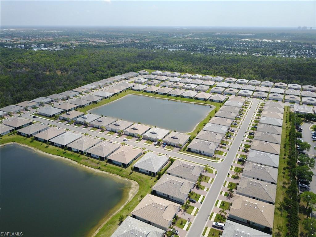 1050 Enbrook Loop Naples, FL 34114 - Photo 25 of 29 a view of a city with tall buildings
